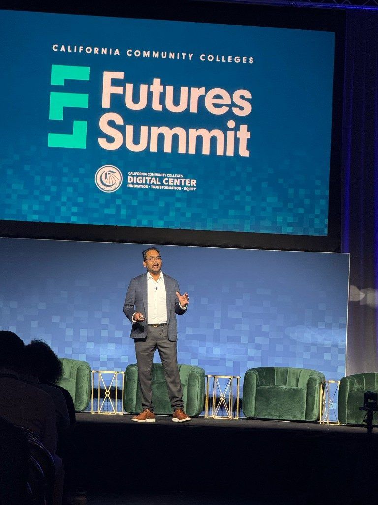Close view of Kiran Kodithala presenting the keynote 'How to build your first AI product' at Futures Summit 2026.