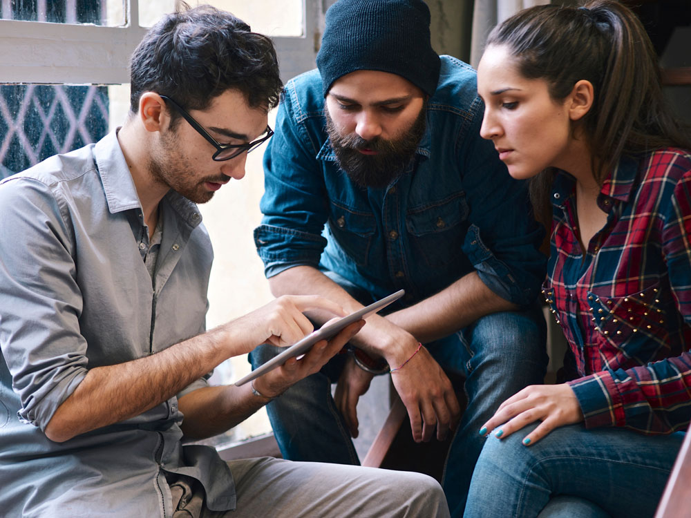 Students collaborating around data insights